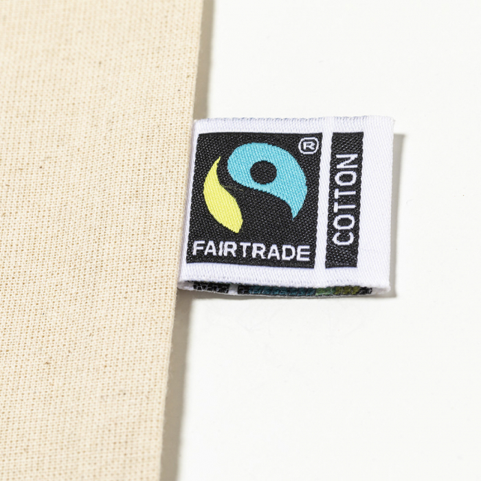 Bolsa Flyca Fairtrade de línea nature, fabricada en 100% algodón de 180g/m2 en tono natural. Bolsas compra de comercio justo promocionales personalizadas. Regalos de empresa y corporativos personalizados